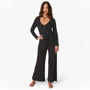 So Chic Jumpsuit. V neckline. Self tie waist. Wide leg opening